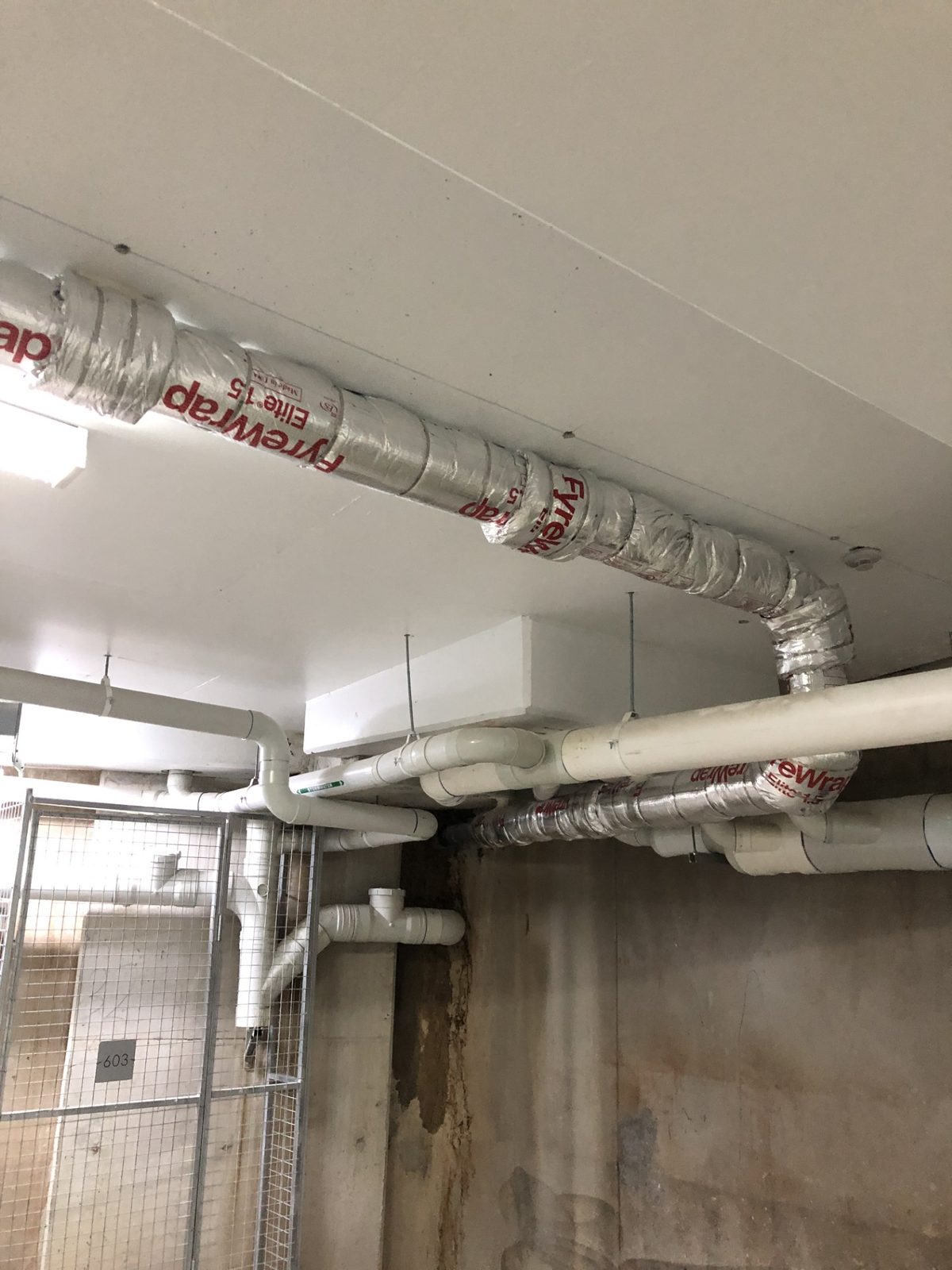 FyreWrap-clad ductwork in a basement carpark — passive fire rectification in Parramatta Western Sydney